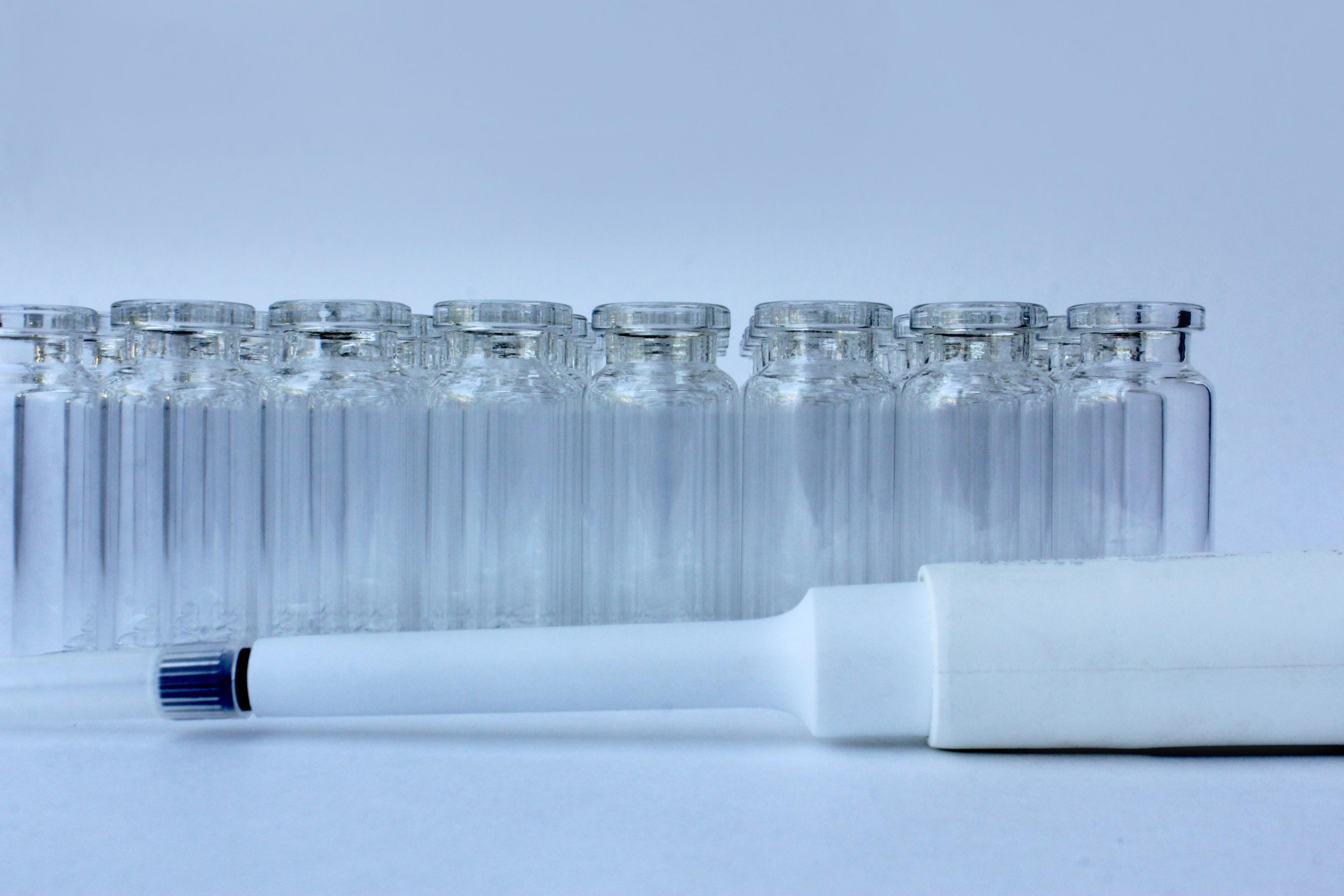 New glass vials for instrumental analysis on a white background. analytical vials prepared for chemical analysis | Image Credit: © Elena - stock.adobe.com