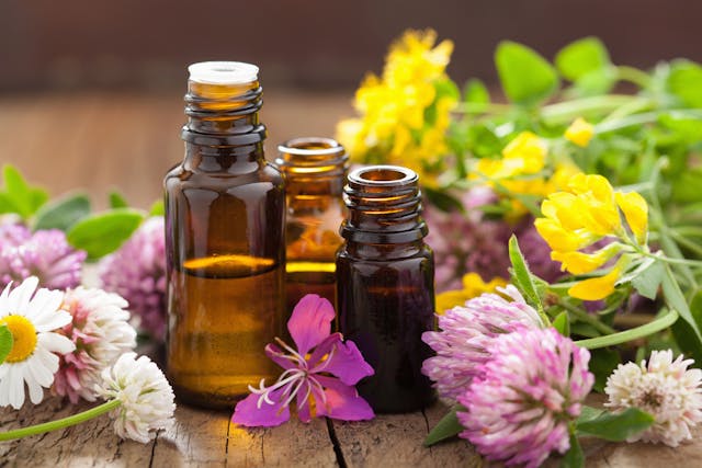 essential oils and medical flowers herbs | Image Credit: © Olga Miltsova - stock.adobe.com