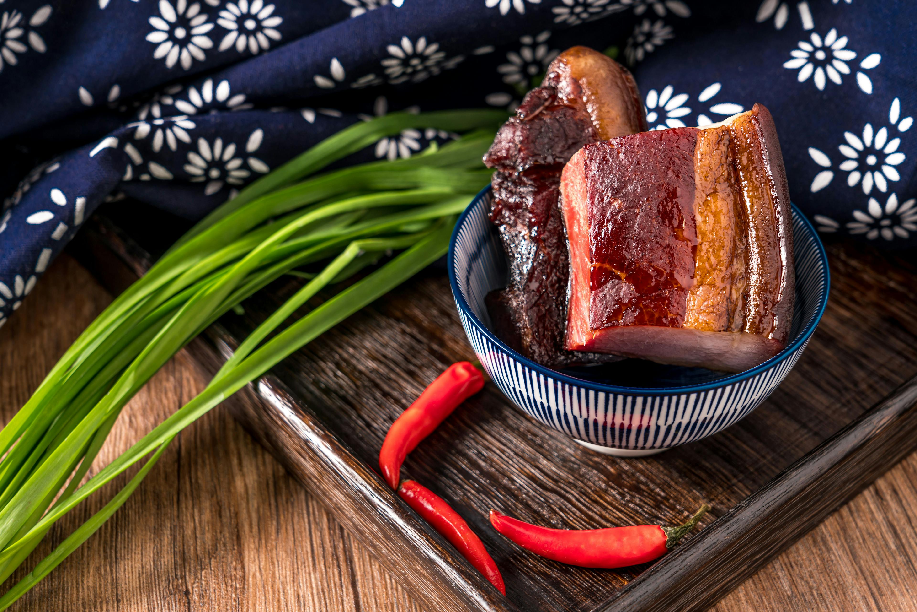 Chinese traditional cuisine bacon on wooden table | Image Credit: © Govan - stock.adobe.com