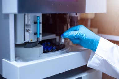 Scientist moved the vial of sample out from the tray autosampler of the Liquid Chromatography Mass Spectrometer LC/MS after the analysis was complete. | Image Credit: © S. Singha - stock.adobe.com